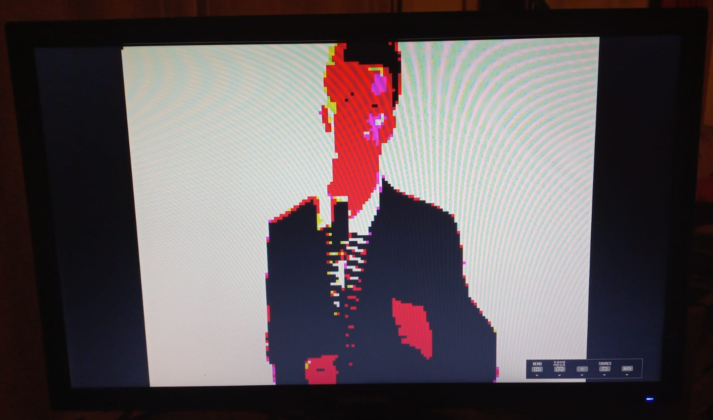 Picture of Rick Astley: Original, and recreation on a monitor by the EV22-G3.